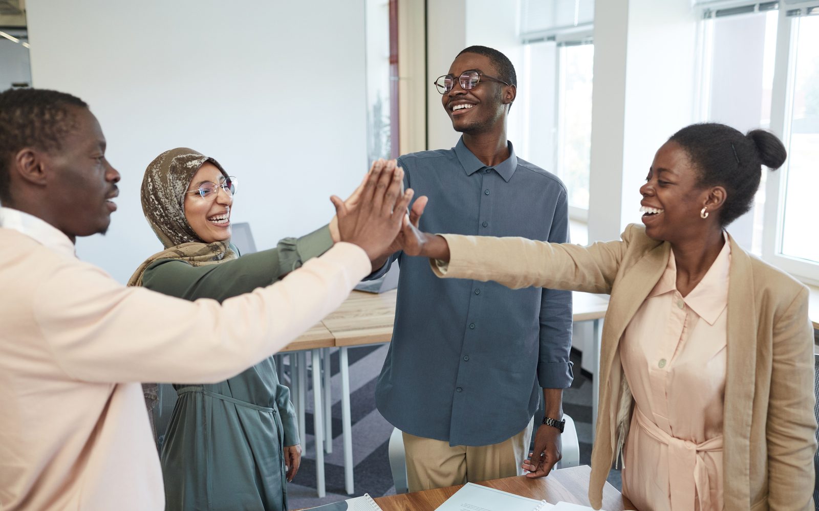 Colleagues celebrating with a high five